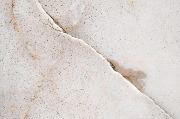 water coming up from cracked slab